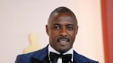 Idris Elba says he's an 'absolute workaholic' and is dealing with it by going to therapy