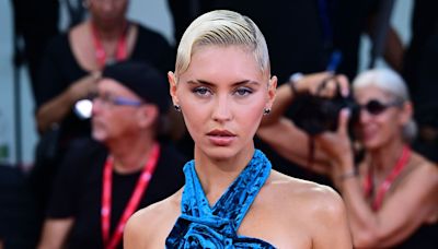 Iris Law shows off her figure in a thigh-split teal gown in Venice