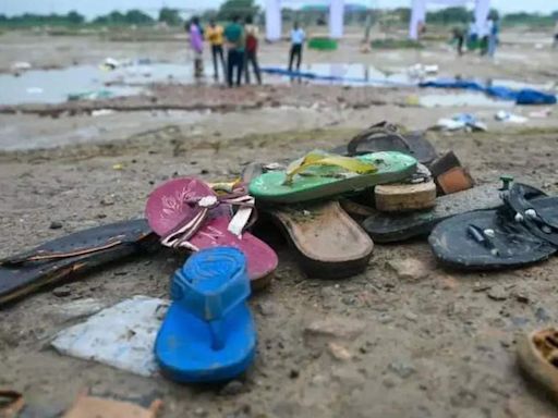 Hathras Stampede: Tragic Tales of Scattered Slippers and Shoes | Agra News - Times of India