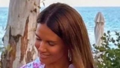 Rebekah Vardy gives cheeky flash of her bottom in a black thong bikini