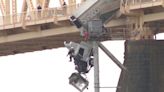 Dramatic video shows harrowing moment truck crashes on bridge in Louisville, Kentucky, left dangling off edge