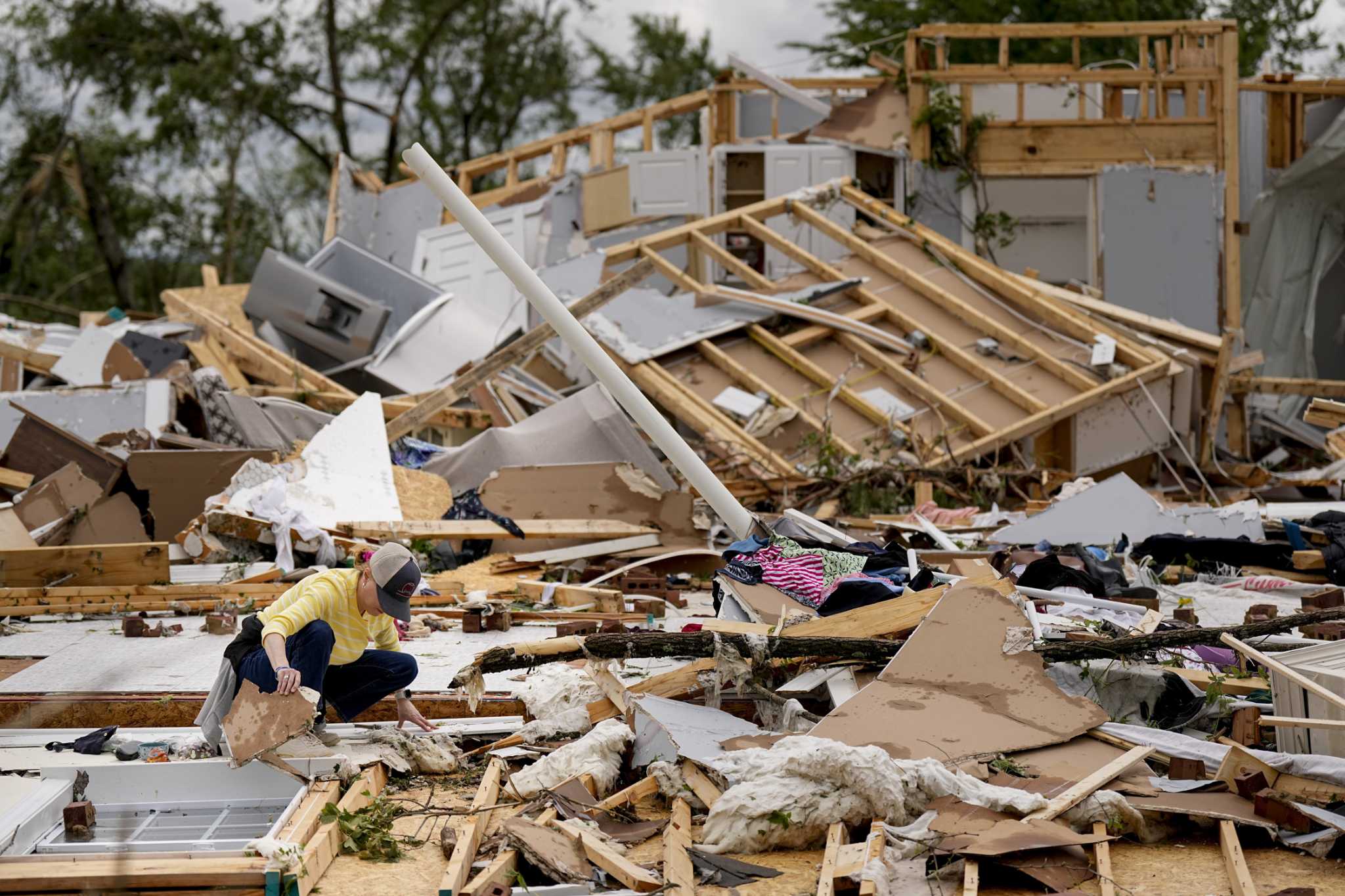 Storm-battered South is again under threat. A boy swept into a drain fights for his life