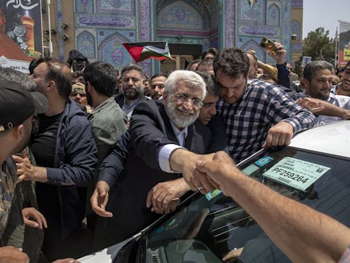 Iran holds runoff presidential vote pitting hard-liner against reformist after record low turnout