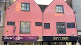 Landlord given prison warning for giving shopfronts 'garish' paint job