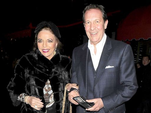 Joan Collins, 90, Wears Sheer, Embellished Top and Oversize Bow for London Date Night with Her Husband Percy Gibson