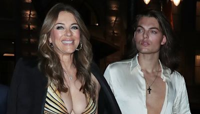 Liz Hurley, 59, shows off her ample cleavage alongside son Damian, 22