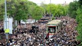 Mourners begin days of funerals for Iran's president and others killed in helicopter crash