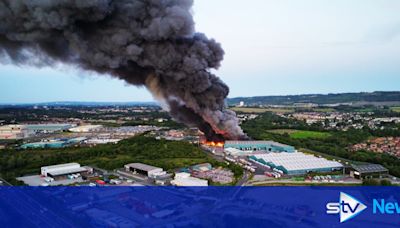 Massive plume of smoke after 'large-scale' fire erupts at industrial estate