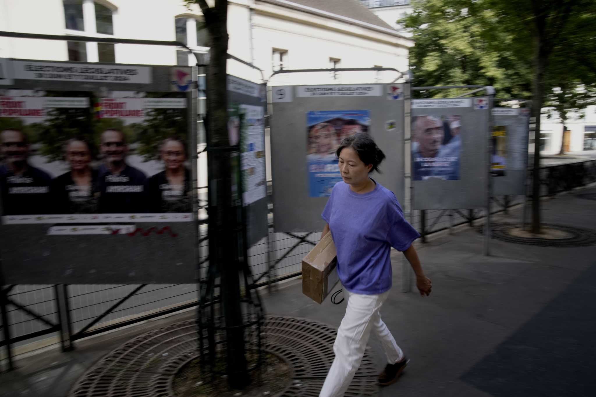 The Latest | Projections show far-right National Rally has strong lead in France's 1st voting round