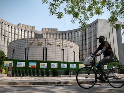 China’s central bank cuts key short-term rate to buoy economy - CNBC TV18