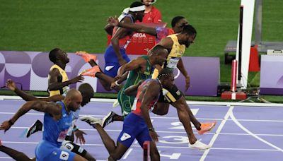 Noah Lyles takes men’s 100m gold by narrowest margin in dramatic Olympic final