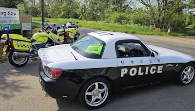 Motorcycle patrol pulls over Japanese 'police' car