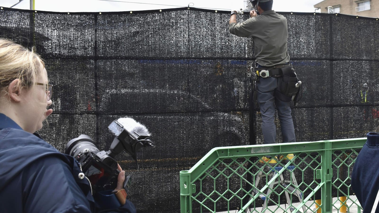 A Japanese town finds holes in a screen built to prevent tourists from snapping photos of Mount Fuji