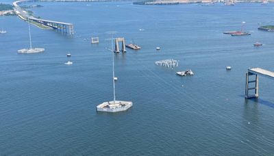 Photos show progress at the Key Bridge collapse site as crews work to remove steel wreckage