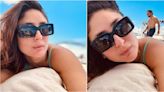 Kareena Kapoor enjoys sunny day on UK beach in teal swimsuit but it's shirtless 'photobomber' Saif Ali Khan who has our attention