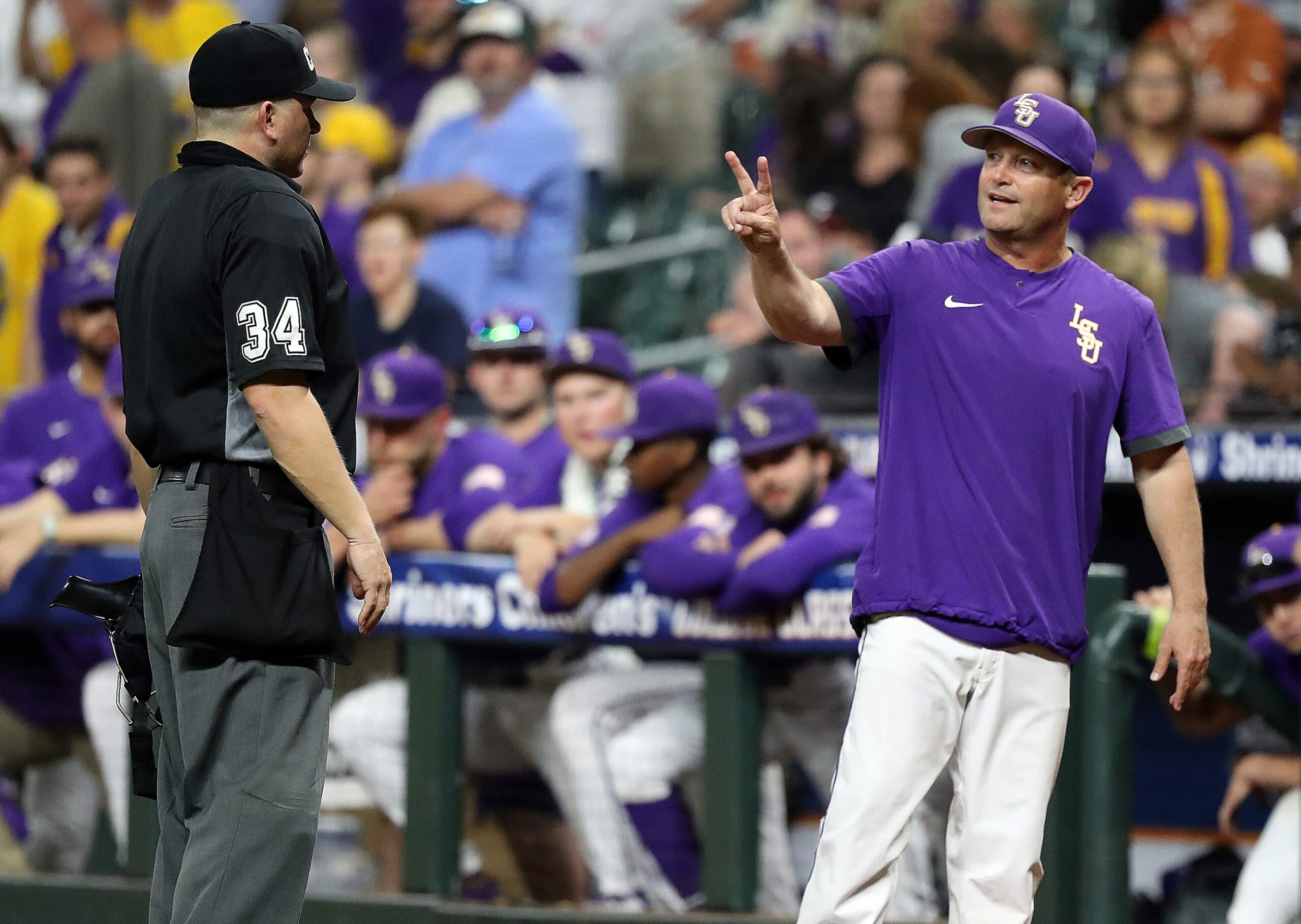 Umpires criticized for controversial fan interference call on Hayden Travinski home run in Game 1 vs. Texas A&M