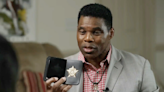 Herschel Walker explains the badge he flashed at Senate debate