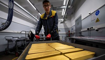 Gold at near 2-week high as soft US data lifts Fed rate-cut bets