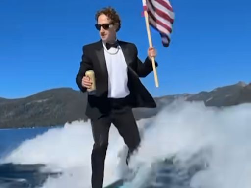 Zuckerberg Wakesurfs in Tuxedo While Holding Flag, Drinking Beer — Sparks Reaction