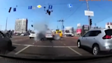 Moving car filmed narrowly missing being hit by missile in Kyiv in dashcam footage