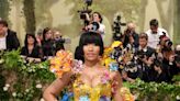 Nicki Minaj Puts On a Quirky Display in Canary Yellow Floral Appliqué Dress at the 2024 Met Gala