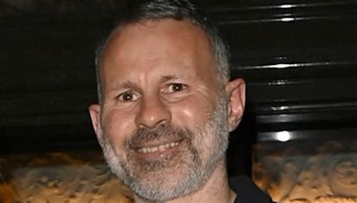 Ryan Giggs, 50, cosies up to his model girlfriend Zara Charles, 35, as they enjoy a date night at a restaurant bash in Manchester