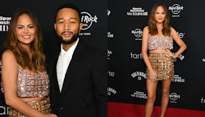 Chrissy Teigen Shines in Beaded Georges Hobeika Mini Skirt for Sports Illustrated Swimsuit Issue Launch Party 2024 With John Legend