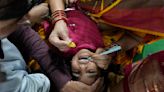 AP PHOTOS: Myriad people flock to Indian city to swallow live fish with 'miracle cure' to asthma