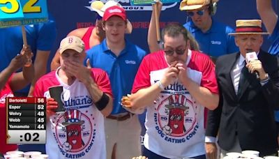 Hot Dog Eating Contest: Man Eats 58 Hot Dogs In 10 Minutes To Win The Mustard Belt And $20,000 Prize