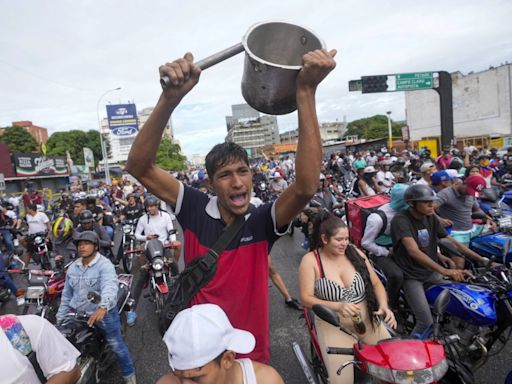 Crowds take to Venezuelan streets to protest what they say is president's attempt to steal election
