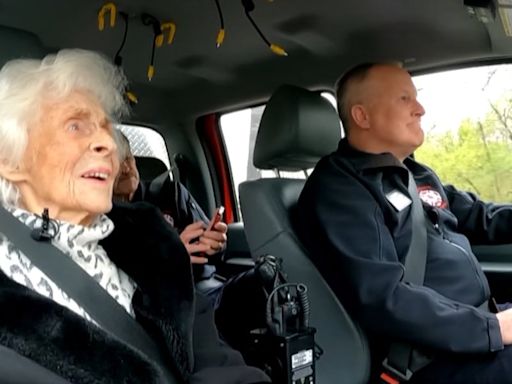 105-year-old celebrates birthday by riding along with firefighters, police