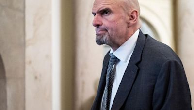 Sen. Fetterman takes off Harvard University hood during commencement speech, gets standing ovation