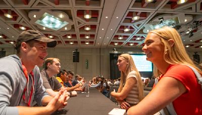 Thousands of young LDS singles gather for speed dating, music, messages and to sign a special birthday card