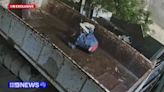 CCTV shows alleged intruder falling from roof in front of police officers