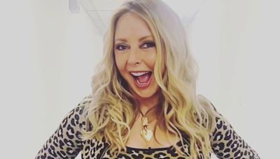 Carol Vorderman leaves fans hot under the collar as she shows off her curves