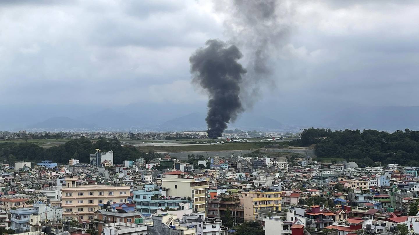 A plane carrying 19 people slips off the runway and crashes in Nepal, and the pilot survives