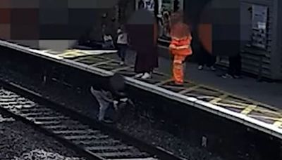 LNER releases footage showing moment child was rescued from rail track seconds before train passed through