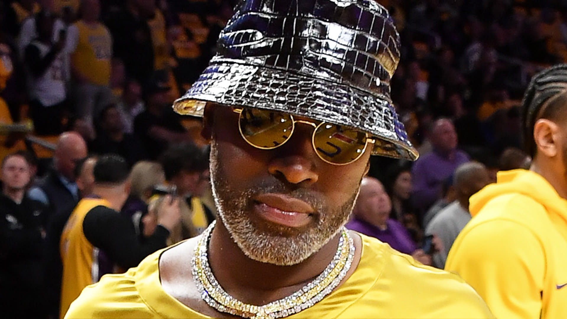 Corey Gamble critics mock star's 'silk dress' and 'plastic' hat look NBA game