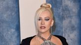 Christina Aguilera had to find 'balance' between work and motherhood: 'I'm trying to figure it out'