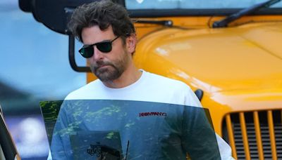 Bradley Cooper oozes movie star cool with gleaming black shades