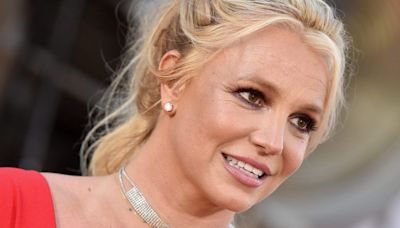 Britney Spears shared a photo of her bruised ankle and said she felt 'harassed' after paramedics responded to a 911 call to her hotel