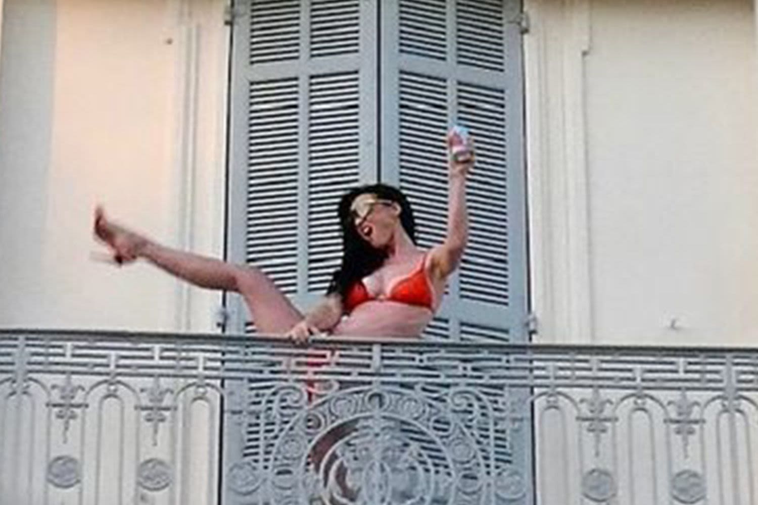 Katy Perry Does Hotel Balcony High Kick in Bright Orange Bikini: 'I'ma Get Your Heart Racing'