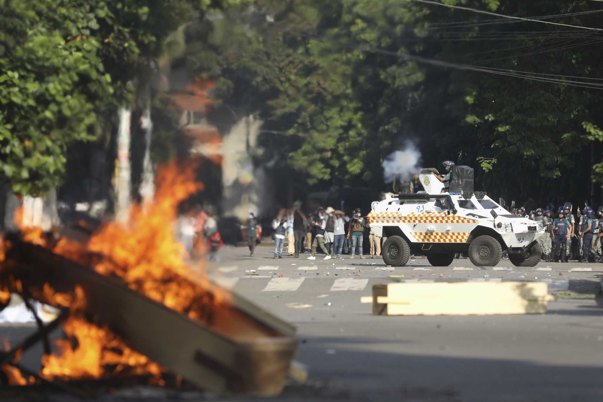 Universities in Bangladesh shut their doors and authorities raid opposition HQ after deadly protests