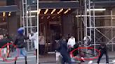 Migrants swing bats, belts and even traffic cones at each other in wild brawl outside NYC hotel