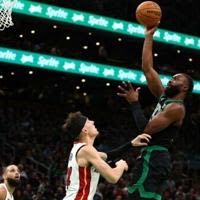Boston's Jaylen Brown soars over Miami's Tyler Herro as the Celtics completed a 4-1 playoff series victory