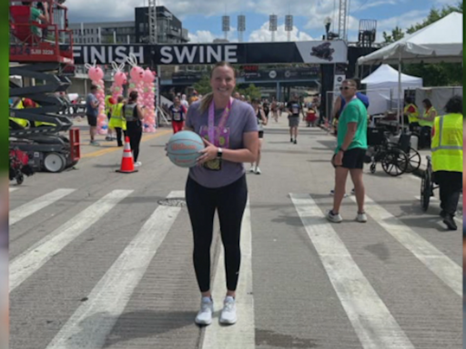 Area basketball coach completes Flying Pig Marathon while dribbling basketball