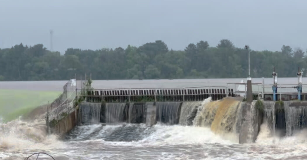 River Surges Over Wisconsin Dam Amid Heavy Rain, Imperiling Small City