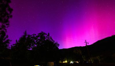 Jaw-dropping northern lights from massive solar flares amaze skywatchers around the world. 'We have a very rare event on our hands.' (photos)