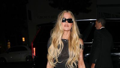 Khloé Kardashian stuns in nude maxi dress with huge slit and bejwelled braid