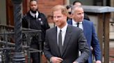 Prince Harry says tabloids intercepted phone calls of mother, the late Princess Diana, and father